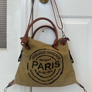 Paris Stamp Canvas Tote Bag with Brown Leather Trim. Travel with this bag.